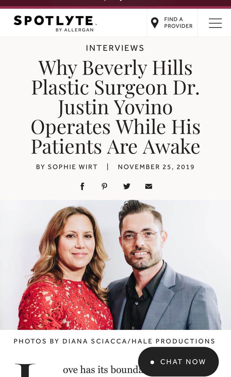 A screenshot of the top of an article by Spotlyte by Allergan titled "Why Beverly Hills Plastic Surgeon Dr. Justin Yovino Operates While His Patients Are Awake" by Sophie Wirt from November 25th, 2019. The screenshot features an image of Dr. Justin Yovino and Dr. Sarah Yovino dressed nicely.