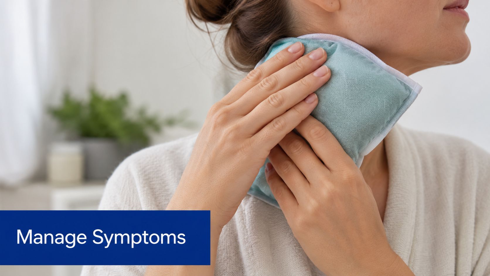 A person gently holding a cooling gel pack against their neck while recovering at home.