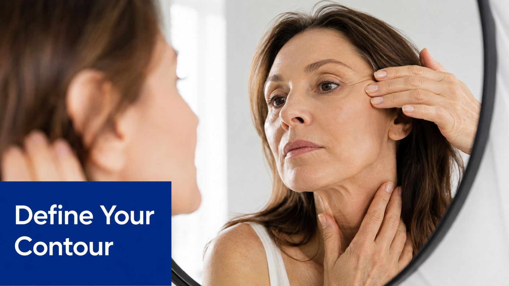 A mature woman looking in a mirror and touching her face and neck to evaluate skin elasticity.